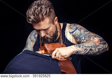 Worker Of Leather Producing Leather Workpiece At His Workshop