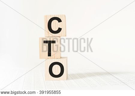 Word Cto On Wooden Blocks, White Background, Business Concept. Business And Finance