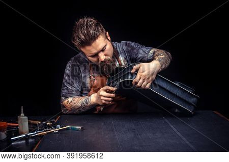 Professional Tanner Working As Artisan At His Leather Studio