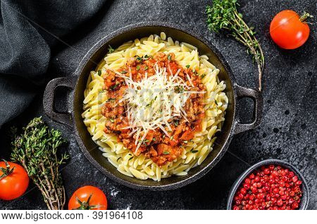 Bolognese Pasta, Risone With Ground Beef In A Plate. Black Background. Top View