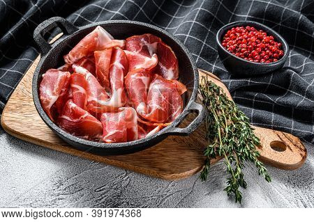 Italian Rolled Bacon Pancetta Piacentina. Pork Meat. White Background. Top View