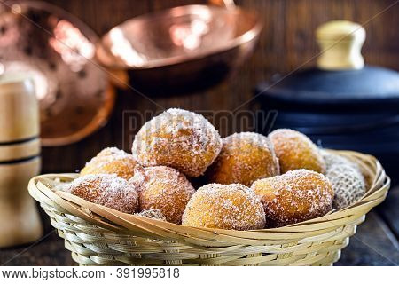Homemade Fried And Sweet Ricotta Dumplings With Powdered Sugar, Known As Fritule Or Rain Dumpling