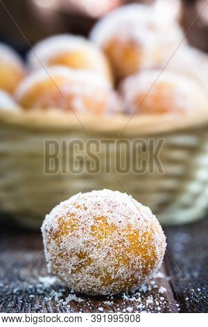 Homemade Fried And Sweet Ricotta Dumplings With Powdered Sugar, Known As Fritule Or Rain Dumpling