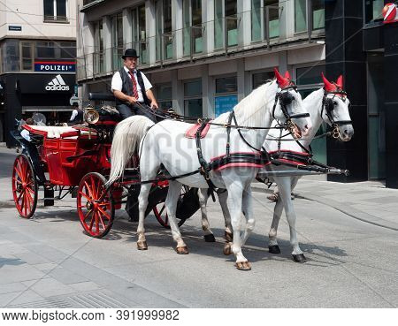 Vienna, Austria - July 30, 2019: Fiacre, Horse-drawn Carriage, Traditional Tourist Vehicle In Vienna