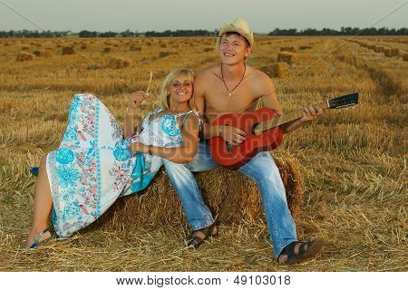 A Pair Of Lovers In The Hay With Guitar