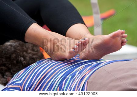 Woman Receives Ashiatsu Barefoot Massage At Summer Festival