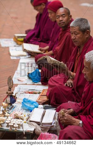 Monks Praying At Bouddanath Temple In Kathmandu