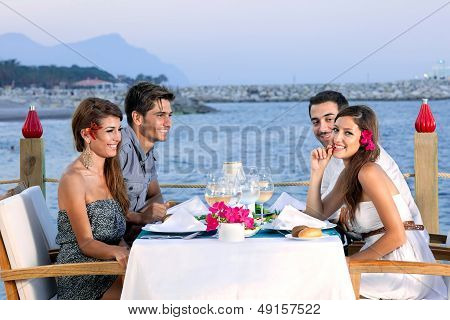 Couples Celebrating At A Seaside Restaurant
