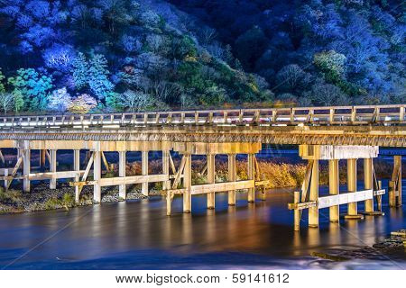 Arashiyama, Kyoto, Japan at Togetsukyo Bridge during the annual autumn light up.