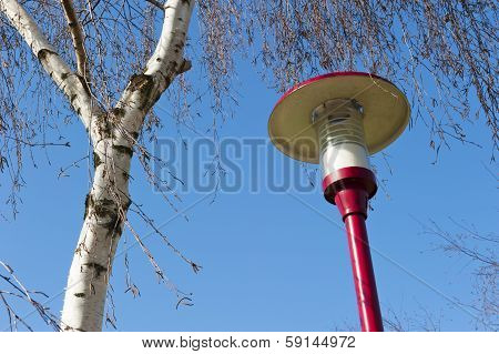 Ancient Lamppost At Parking Of Gasstation On Highway
