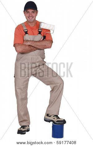 Man resting foot on pot