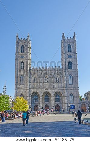 MONTREAL, CANADA, OCTOBER 12, 2013 - Place d Armes and Notre-Dame Basilica, Gothic revival church inaugurated in 1829