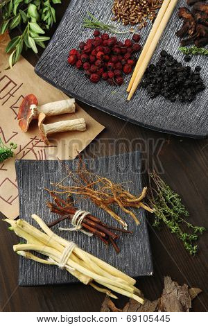 Traditional chinese herbal medicine ingredients with not real hieroglyphs, close-up