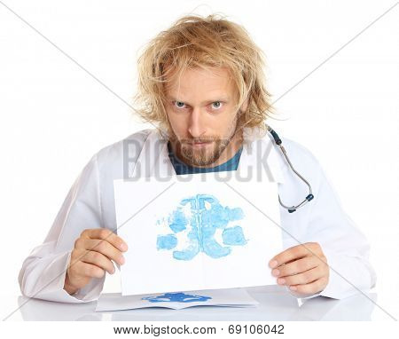 Funny psychotherapist holding Rorschach test