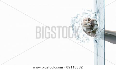 Close up of male fist breaking glass with punch