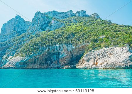 Rocky Shore And Blue Sea