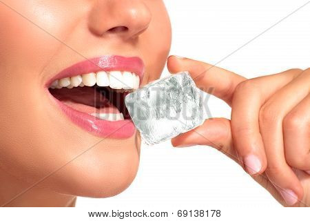 Closeup Of Beautiful Woman Biting An Ice Cube