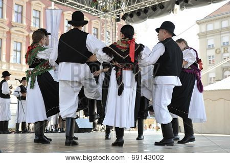 ZAGREB, CROATIA - JULY 19: Members of folk group Seljacka sloga from Donja Dubrava, Croatia during the 48th International Folklore Festival in center of Zagreb, Croatia on July 19, 2014