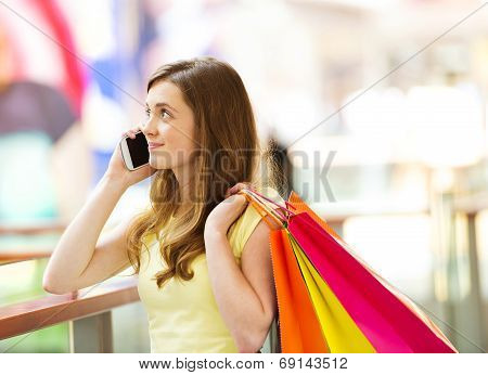 Shopping girl with smartphone
