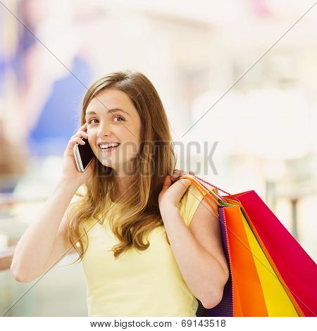 Shopping girl with smartphone
