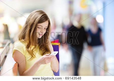 Shopping girl with smartphone