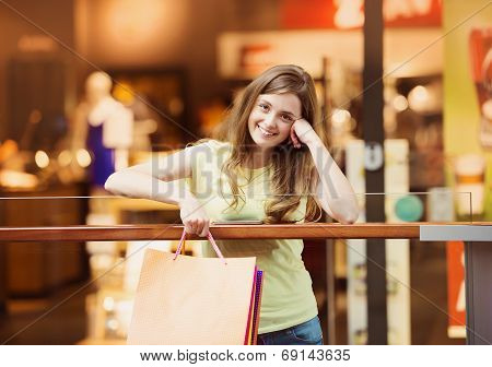 Shopping girl with smartphone
