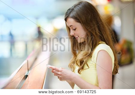 Shopping girl with smartphone
