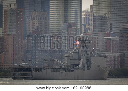 NEW YORK - MAY 27: USS Oak Hill (LSD 051) passes the financial district in Lower Manhattan on the Hudson River at the end of Fleet Week NY. Image contains visible atmospheric distortion.  