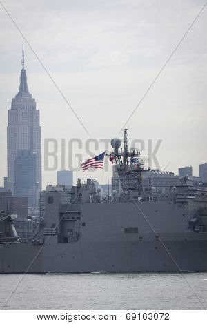 NEW YORK - MAY 27: USS Oak Hill (LSD 051) passes the Empire State Building after departing Pier 92 on the Hudson River at the end of Fleet Week NY on May 27, 2014. 