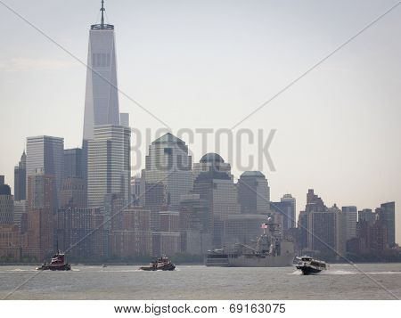 NEW YORK - MAY 27: USS Oak Hill (LSD 051) passes the Freedom Tower and financial district of Lower Manhattan after departing Pier 92 on the Hudson River at the end of Fleet Week NY on May 27, 2014.  
