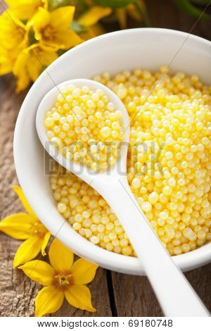 spa with yellow herbal bath pearls and flowers