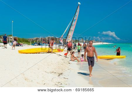 CAYO SANTA MARIA, CUBA - JULY 16, 2014 : Tourists enjoying a sunny day at the beach