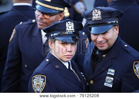 NYPD officers with black ribboned badges