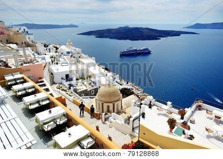 Fira, Greece - May 17: The View On Fira Town And Tourists Enjoying Their Vacation On May 17, 2014 In