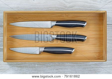 New Wooden Kitchen Drawer With Clean Knife Set On White Wood
