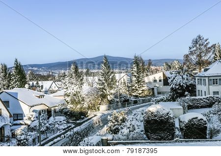 Snow Coverede Houses And Mountains In Schwalbach