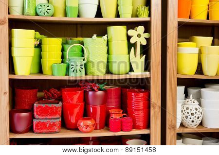 Red And Yellow Ceramic Flowerpots In The Florist Store