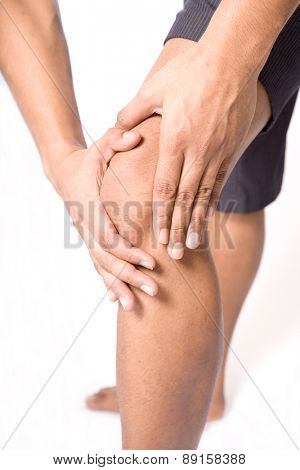Man with both palm around knee cap to show pain and injury on knee area.