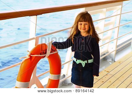 Little Girl Standing On Deck Of Cruise Ship