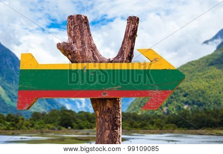 Lithuania Flag wooden sign with mountains background
