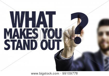 Business man pointing the text: What Makes You Stand Out?