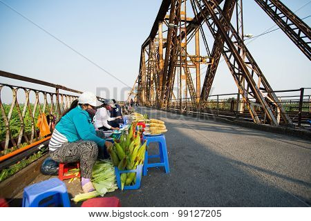 Street vendor on Long Bien bridge, Hanoi, Vietnam