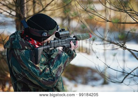 boys playing with gun during laser tag