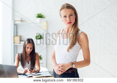 Portait of beautiful successful business woman looking confident and serious.