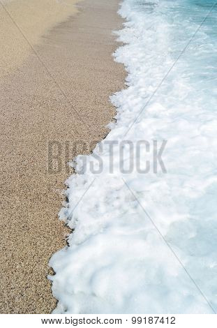 Sand Beach And Blue Wave Sea