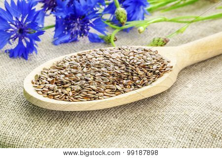 Flax seeds on wooden spoon