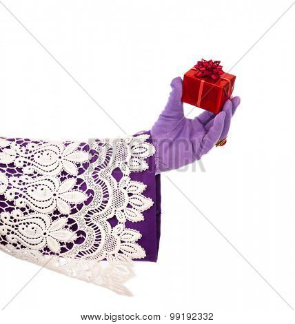 Hand of sinterklaas  with gift . typical Dutch character part of a traditional event celebrating the birthday of Sinterklaas (Santa Claus) in december.