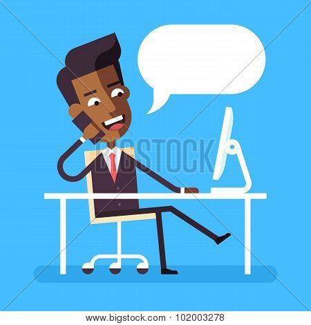 Handsome african american manager in formal suit sitting legs crossed at the desk with a computer an
