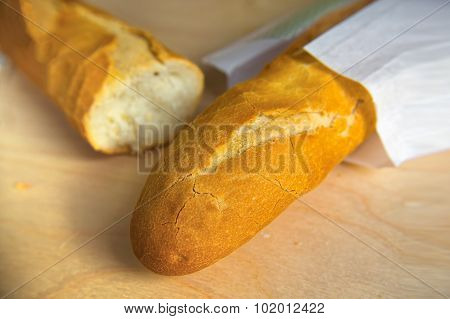 Long Loaf French Baguette On Wooden Table