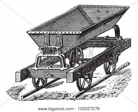 Old engraved illustration of the dumper box fitted with metal sheet and double hinged switch uses for the transportation of concrete. Industrial encyclopedia E.-O. Lami - 1875.